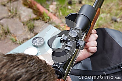 Rifle shooting with optical sight Stock Photo