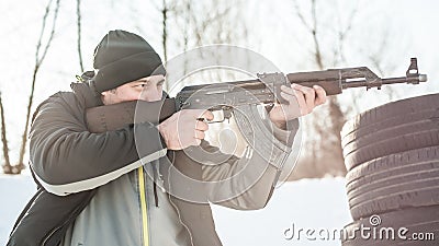 Rifle tactical shooting training behind and around cover or barricade Stock Photo