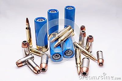 Rifled slug shotgun shells with 223 caliber bullets along with 45 caliber and 9mm hollow point bullets Stock Photo