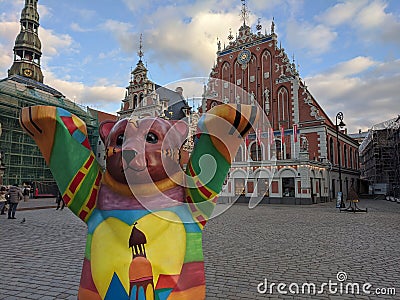 Riga Bear on the Town Hall Square on the background of the House of the Blackheads Editorial Stock Photo
