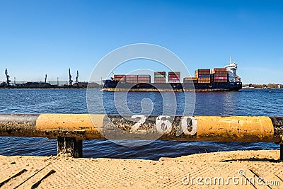 Riga, Latvia - April 20, 2022: Baltic Container Terminal in Freeport of Riga. Riga harbour, Latvia. Container ships in a Editorial Stock Photo