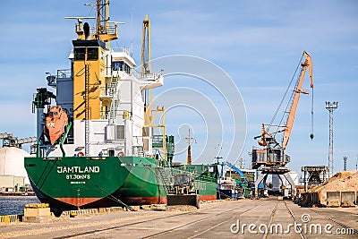 Riga, Latvia - April 20, 2022: Freeport of Riga. Riga harbour, Latvia. Ships in a port. Defocused Editorial Stock Photo