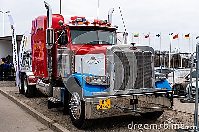 Riga, Latvia - April 12, 2019: Huge red Peterbilt truck parked by the road Editorial Stock Photo