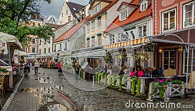 RIGA LATVIA AUG 2018 evening view of the street cafes in the Old Riga on Meistaru street Editorial Stock Photo