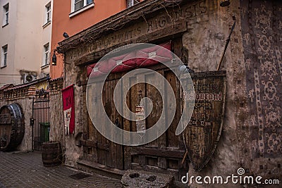 RIGA, LATVIA: Door of medieval restaurant Rozengrals on Rozena iela street in Riga, Latvia. Vinarium Civitatis Rigensis in the old Editorial Stock Photo