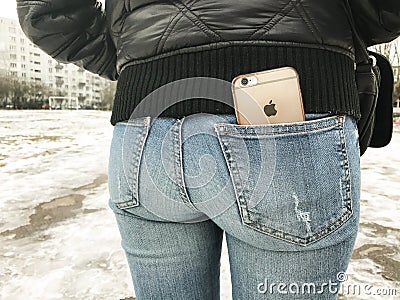 Riga, Latvia - February 04, 2017. iPhone 6 in the back pocket of trousers Editorial Stock Photo