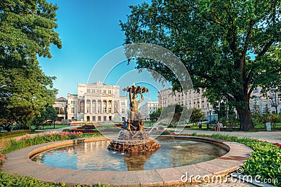 Riga, Latvia. Fountain Nymph In Water Splashes Aspazijas Boulevard Near National Opera House. Editorial Stock Photo
