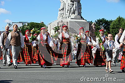 RIGA, LATVIA - JULY 06: People in national costumes at the Latvian National Song and Dance Festival on July 06, 2013. Holiday was Editorial Stock Photo