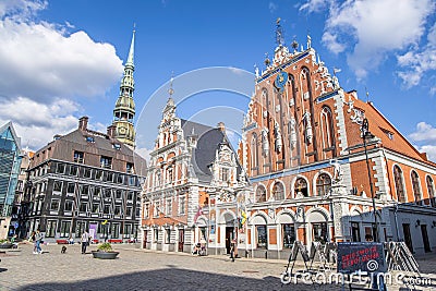Riga, Latvia- July 7, 2023: Town Hall Square, house of the Blackheads, sculpture of Saint Roland and Saint Peters Church in old Editorial Stock Photo