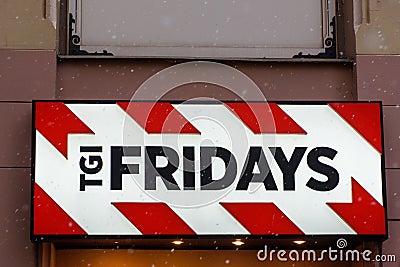 Logo of American company TGI Fridays on wall Editorial Stock Photo