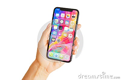 Riga, Latvia - March 15, 2018: Close up photo of latest generation iPhone X in person`s hand. Editorial Stock Photo