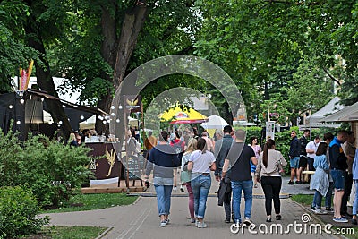 Riga, Latvia - May 24 2019: Group of friends or family walking in streets of Latvian Beer Festival Editorial Stock Photo