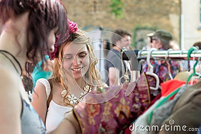 RIGA, LATVIA - MAY 24, 2014: Miera street Pentecost. Woman shopping in the market Editorial Stock Photo