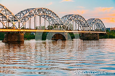 Riga, Latvia. Railway Bridge Through Daugava Or Western Dvina River Stock Photo