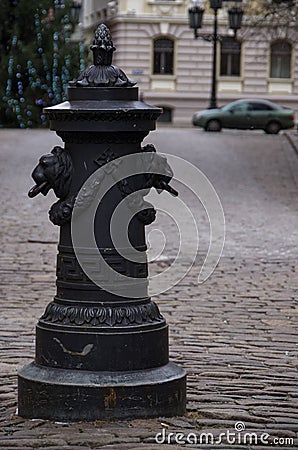 Riga, Latvia. Road pillar with lions heads at Torna street in old town Stock Photo