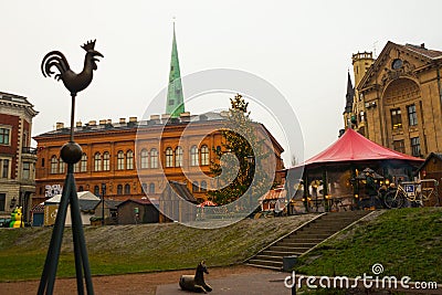 Riga, Latvia: Sculpture of a rooster on a spire in the center of the old city. Church of St. Peter Editorial Stock Photo