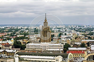 View over the rooftops of the city and the building of the Academy of Sciences in Riga from a height. Editorial Stock Photo