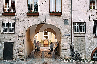 Riga Latvia. Three Young People With Guitar In Arch Of Swedish Gate Editorial Stock Photo