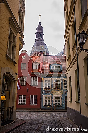 RIGA, LATVIA: View from Kramu Street to the old buildings with one of the oldest restaurant 1221 on the Jauniela street and top Editorial Stock Photo