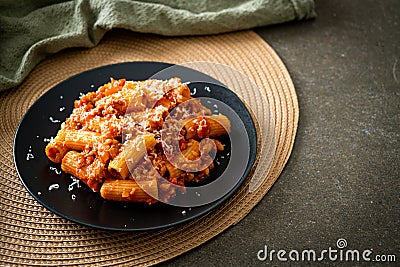 Rigatoni pasta bolognese with cheese Stock Photo