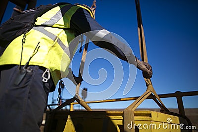 Rigger is commencing final inspection checking three tone lifting sling prior crane lifting the load construction site Sydney Stock Photo