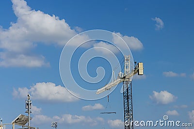 Rigger crane at construction site structural steel large residential buildings Stock Photo