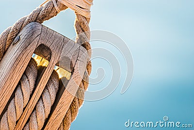 Rigging, maritime scene, close-up of wooden pulley with nautical ropes Stock Photo