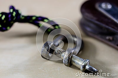 Rigging, sailing accessories. Rope block and shekel on a wooden Stock Photo