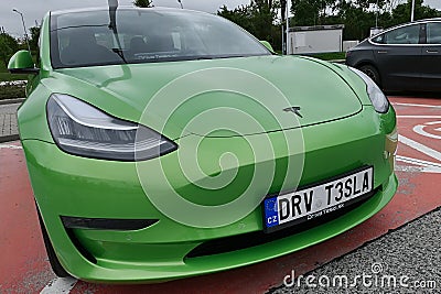 Right front view of front mask of modern compact electric sedan Tesla 3 Editorial Stock Photo