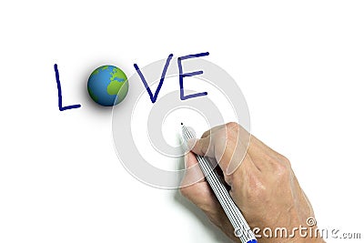 Right hand writing 'LOVE' and the earth Stock Photo