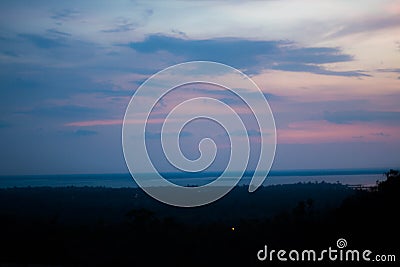 Beautiful silhouette of tree branches against the sky at sunset makes the sky is blue, orange Stock Photo