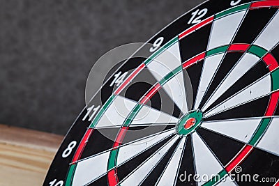 Right on target concept using dart in the bullseye on dartboard Stock Photo