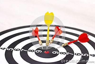 Right to Target Concept Using Darts in Bulseye on Darts Business Success Concept. destruction of competition. Stock Photo