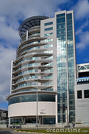 The right tower of the Varna Towers - modern business, shopping and entertainment center on a sunny day against a blue sky with cl Editorial Stock Photo