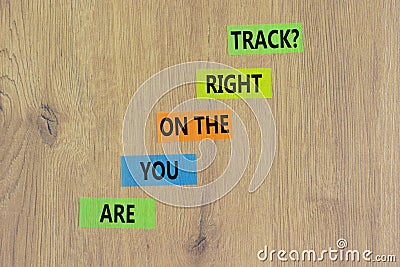 Right track symbol. Concept words Are you on the right track on colored paper on a beautiful wooden table wooden background. Copy Stock Photo