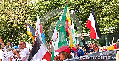 Right-wing Protestants with the black, white and red war flag of the German Empire and flags of compatriots Editorial Stock Photo