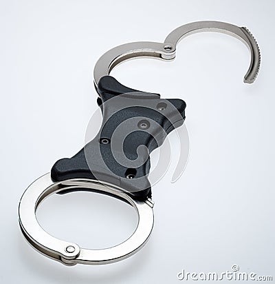 Rigid bar handcuffs Stock Photo