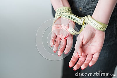 Rigid diet fasting slimming self control hands Stock Photo