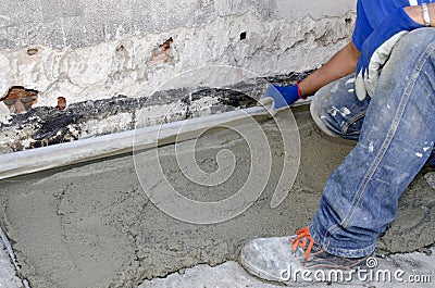 Rigone to smooth the concrete Stock Photo