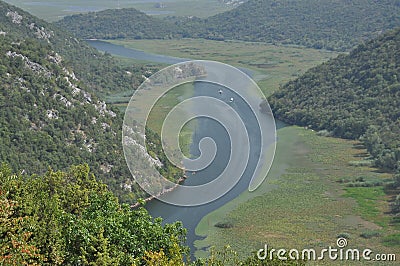 Rijeka CrnojeviÄ‡a, part of the Skadar Lake in Montenegro. Tourist cruises by boat on the beautiful meanders of the river flowing Stock Photo