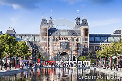 Rijksmuseum Amsterdam with a reflection in a pont Editorial Stock Photo