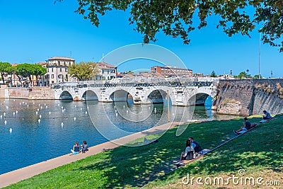 Rimini, Italy, September 2, 2021: Bridge of Tiberius (Ponte di Tiberio) in Rimini, Italy. Editorial Stock Photo