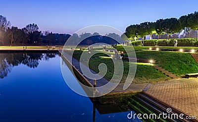 Rimini sunset view of city park with evening lights. Modern and ancient architecture Stock Photo