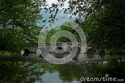 Rimski most or Roman bridge reflecting in the Bosna river Stock Photo