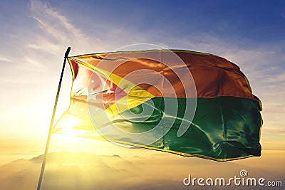 Rincon municipality of Puerto Rico flag textile cloth fabric waving on the top sunrise mist fog Stock Photo