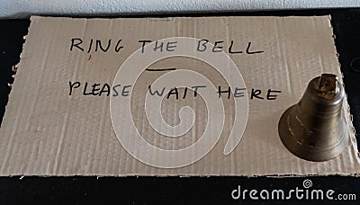 Ring the bell please wait here Stock Photo
