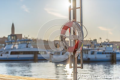 Ring buoy mounted by the river.. Editorial Stock Photo