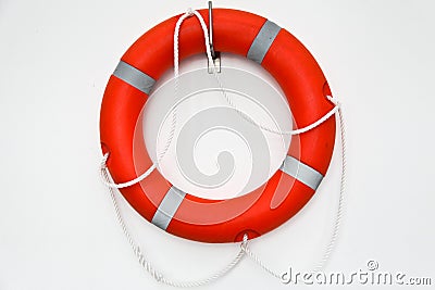 Ring buoy on a white wall Stock Photo