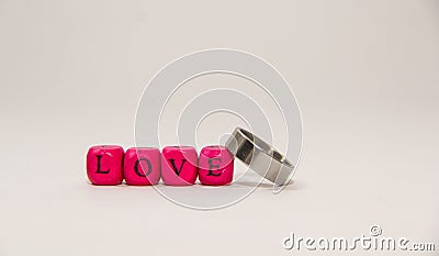 Ring and cube alphabet with love word isolated on white background Stock Photo
