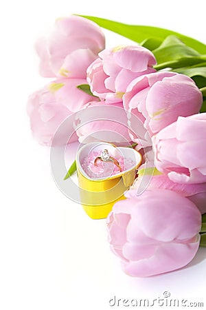 Ring and tulips isolated on white Stock Photo